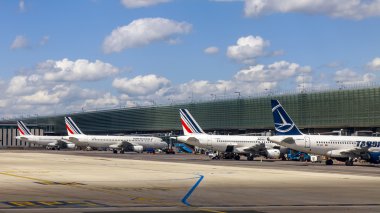 PARIS, FRANCE - on MAY 5, 2015. The international airport Charles de Gaulle, a view of the terminal E and the planes having preflight training from a window of the flying-up plane