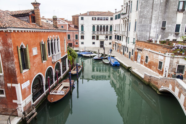 VENICE, ITALY - on MAY 3, 2015. The top view from a window of the house standing on the coast of the channel