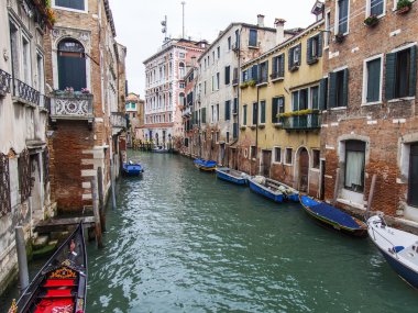 VENICE, ITALY - on MAY 3, 2015. The typical Venetian street canal and old houses on coast