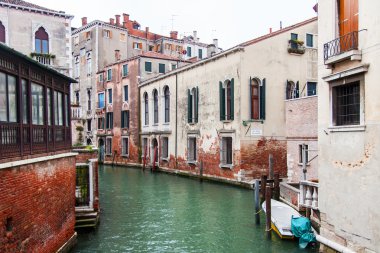 VENICE, ITALY - on MAY 3, 2015. The typical Venetian street canal and old houses on coast