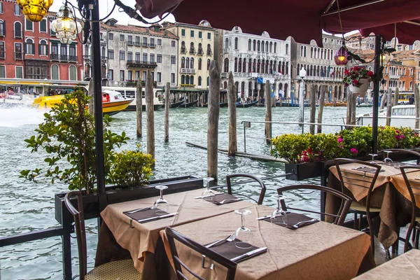 VENICE, ITALY - on MAY 3, 2015. Summer cafe on the bank of the Grand channel (Canal Grande)