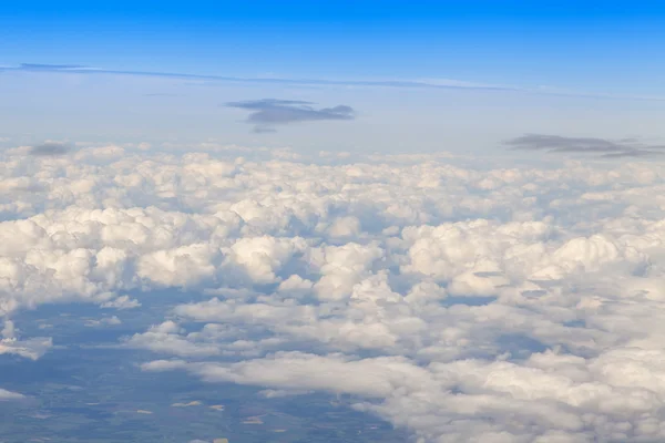 View from the window of the flying plane on clouds — Stock Photo, Image