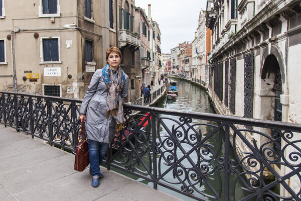 VENICE, ITALY - on MAY 4, 2015. The happy tourist goes sightseeing