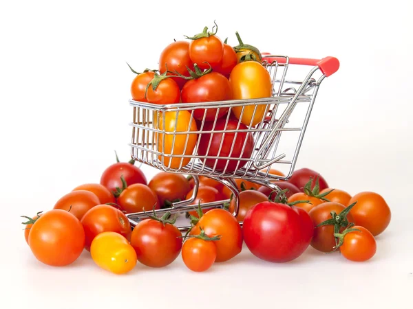 Cherry tomatoes of various grades in the cart from hypermarket — Stock Photo, Image