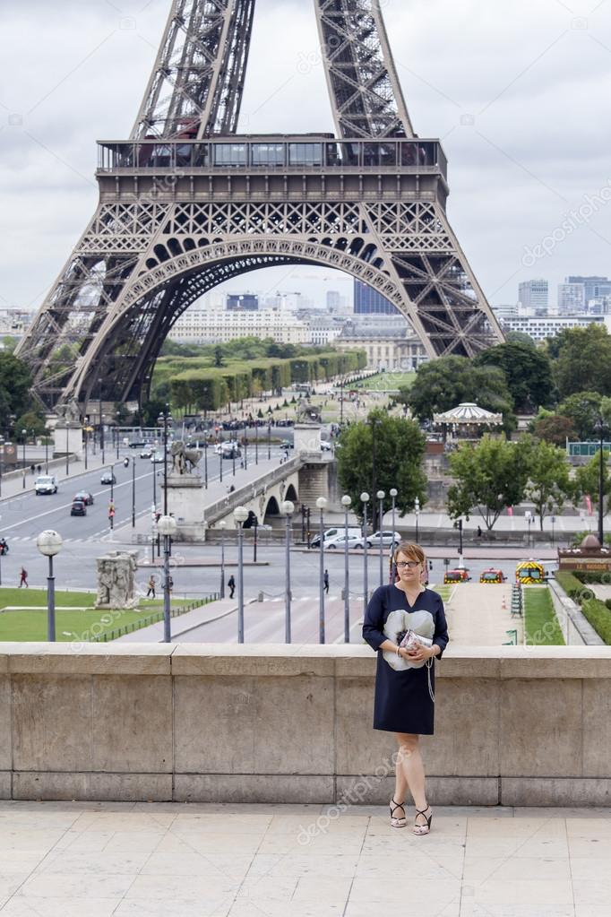 PARIS, FRANCE, on SEPTEMBER 1, 2015. The tourist is photographed near the Eiffel Tower