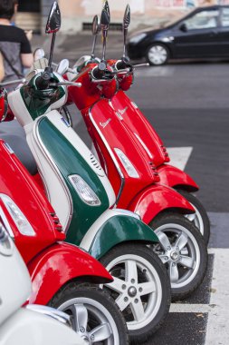 ROME, ITALY, on AUGUST 25, 2015. Bright scooters are parked on the city street