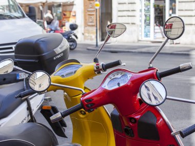 ROME, ITALY, on AUGUST 25, 2015. Bright scooters are parked on the city street