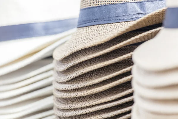 Piles of hats on a show-window of shop — Stock fotografie