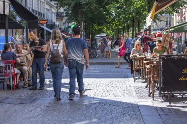 PARIS, FRANCE, on AUGUST 26, 2015. Typical city street in the summer sunny day
