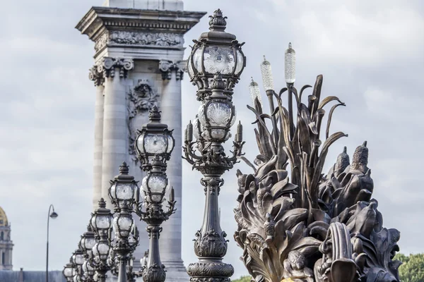 PARIS, FRANCE, on SEPTEMBER 29, 2015. Decorative streetlights on Alexander III Bridge — Stock Photo, Image
