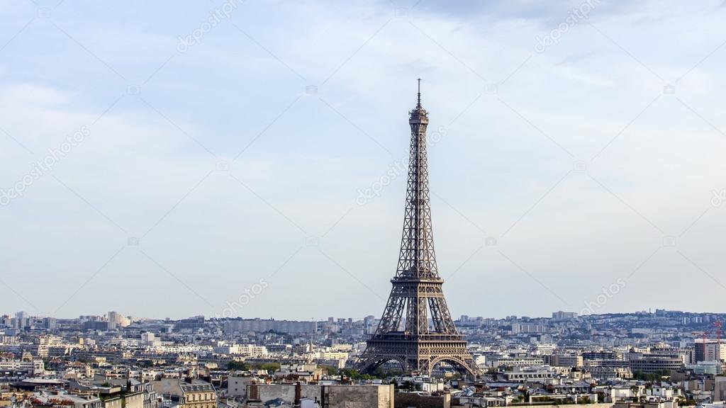 PARIS, FRANCE, on AUGUST 30, 2015. The top view from a survey platform on Arc de Triomphe on the Champs Elysee. Roofs of Paris and Eiffel Tower