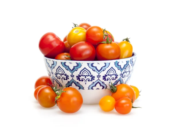 Cherry tomatoes in a figured bowl — Stock Photo, Image
