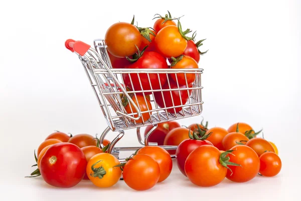 Cherry tomatoes in the cart for purchases — Stock Photo, Image