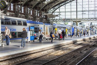 LILLE, FRANCE, on AUGUST 28, 2015. Platforms of the railway station. Trains and passengers.