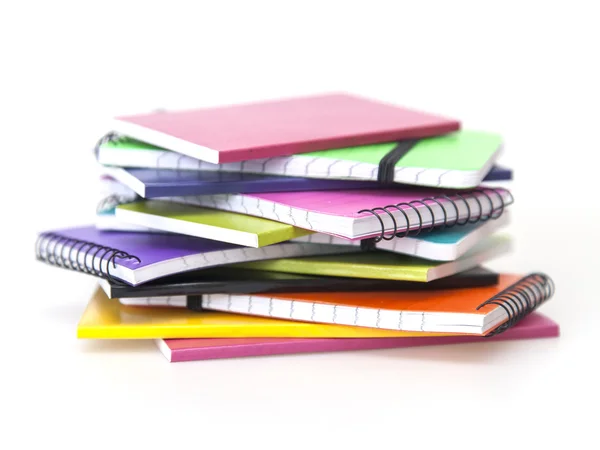 Rough pile of notebooks in covers of various colors — Stock Photo, Image