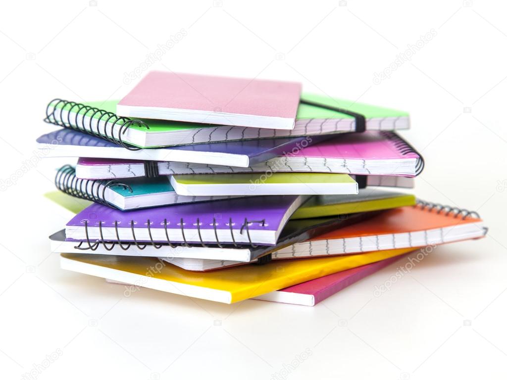 Rough pile of notebooks in covers of various colors