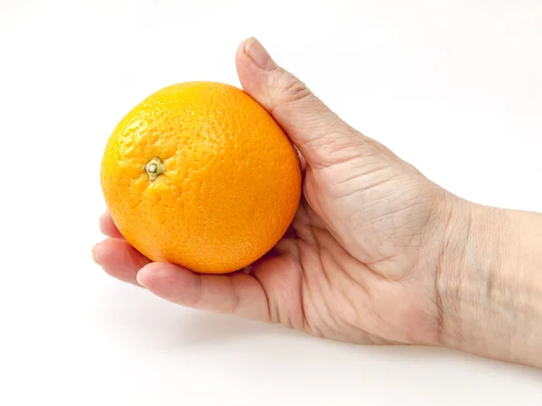 Smaker oransje i en hånd. – stockfoto
