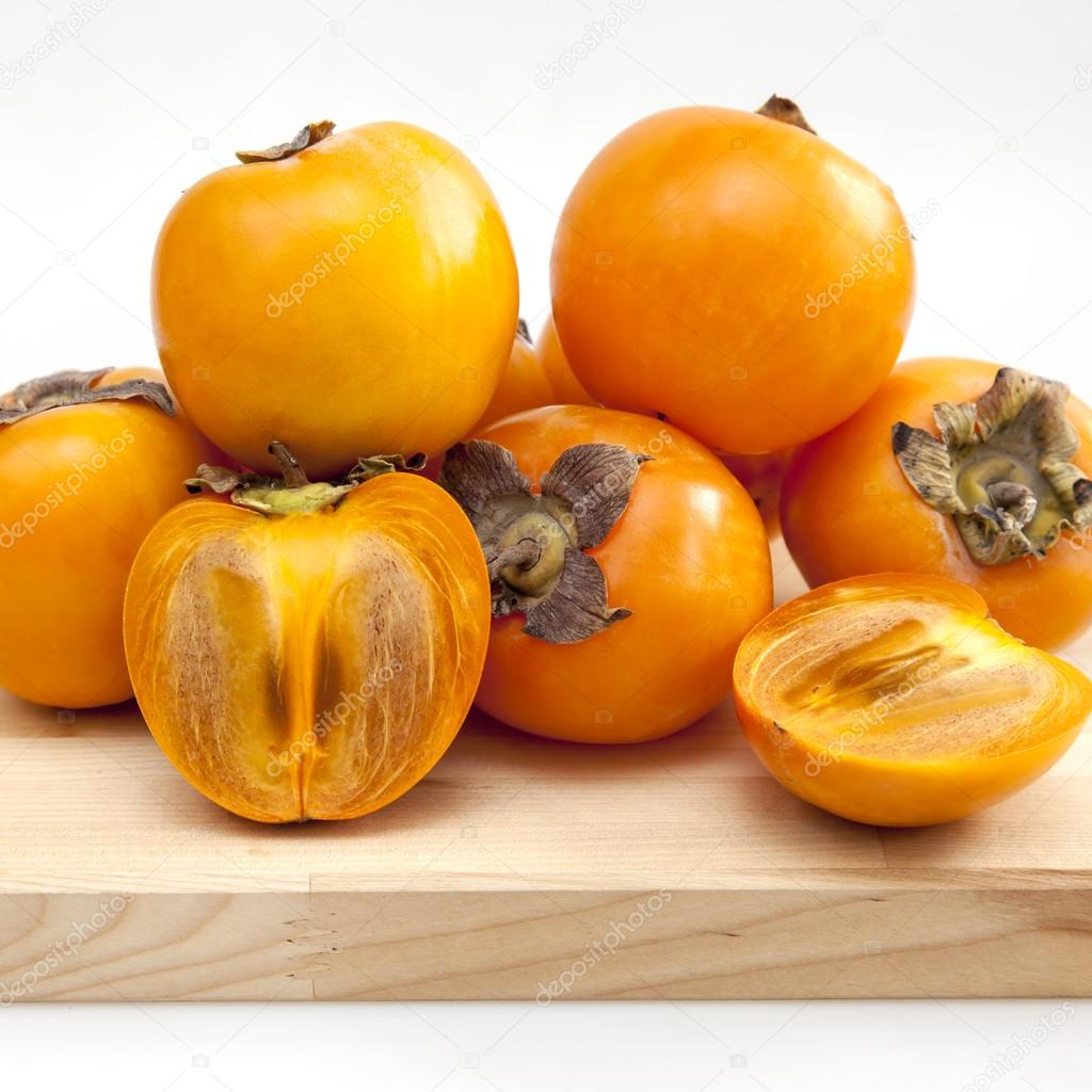 Ripe juicy persimmon on a table