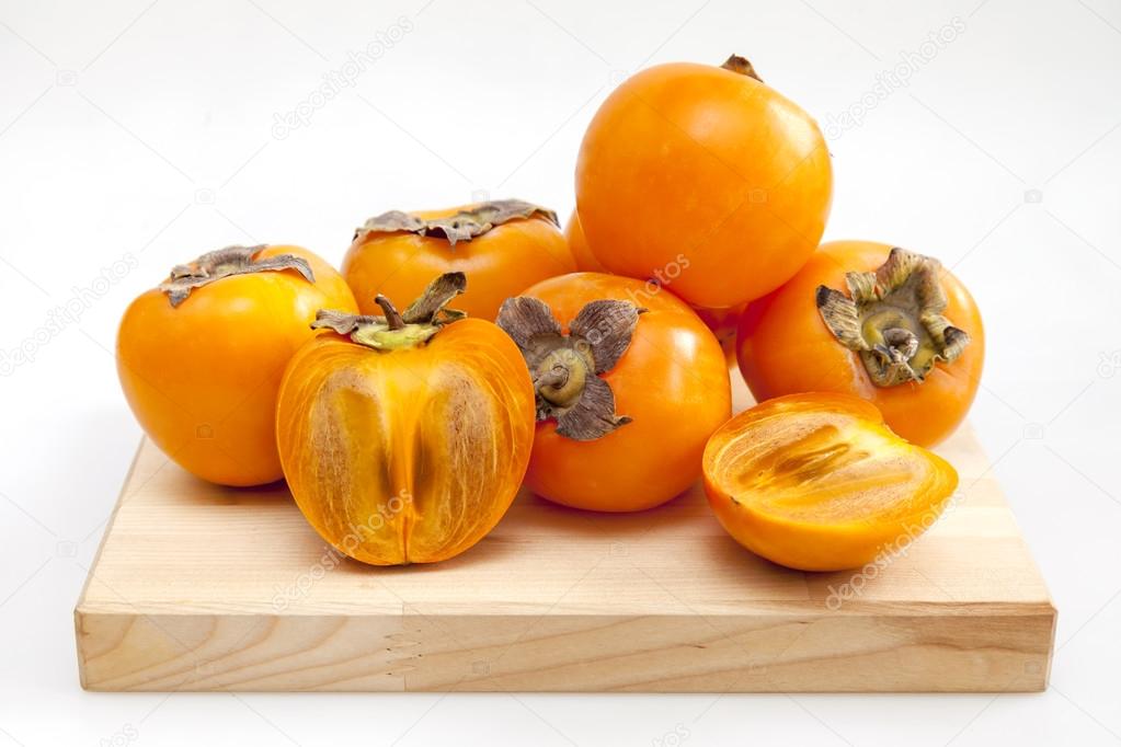 Ripe juicy persimmon on a table