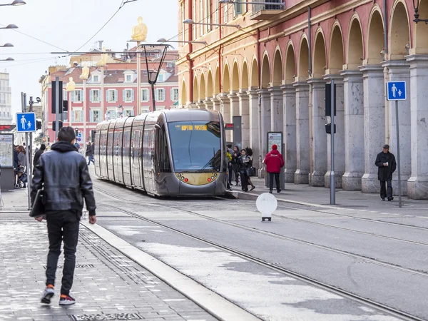 NICE, FRANCE, on JANUARY 7, 2016. The modern high-speed tram goes on Jeanne Medsen Avenue — Stock Photo, Image