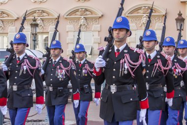 MONTE-CARLO, MONACO, on JANUARY 10, 2016. Carabineers of the prince. Ritual of changing of the guard near the palace of the prince clipart