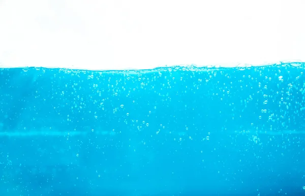 Blue water soda splash on isolated background