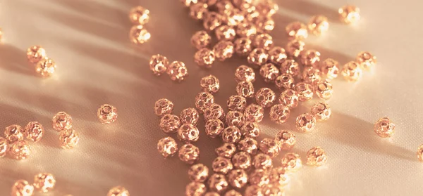 Beautiful Golden Metal Beads Closeup White Background — Stock Photo, Image
