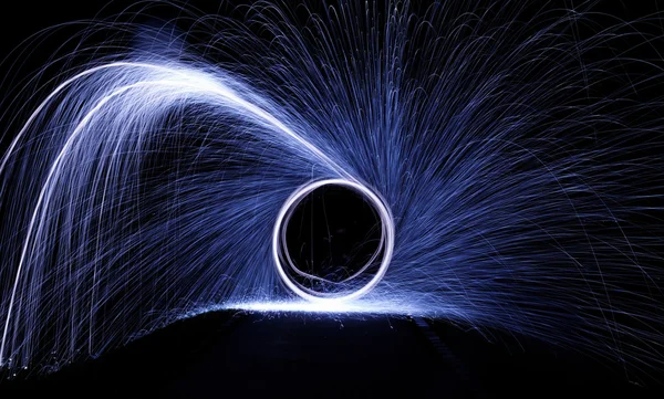 Glowing sparks from spinning steel wool — Stock Photo, Image