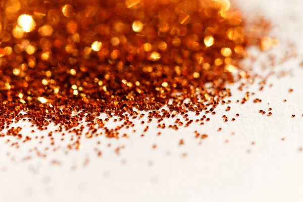 Golden glitter on white — Stock Photo, Image