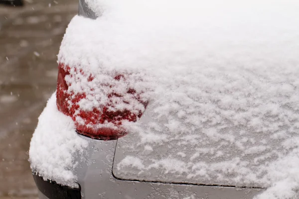 Car's snowy headlight — Stock Photo, Image