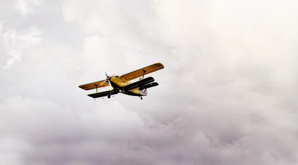 Plane in cloudy sky — Stock Photo, Image