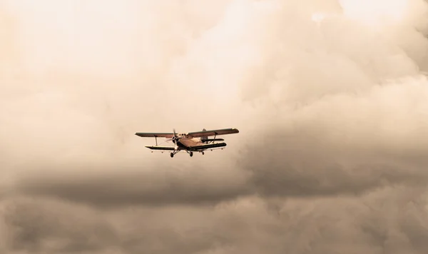 Plane in cloudy sky — Stock Photo, Image