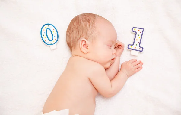 Newborn baby lying in bed — Stock Photo, Image