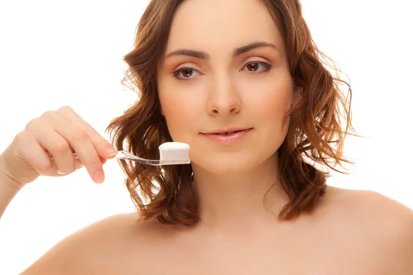 Mujer con cepillo de dientes aislado en blanco —  Fotos de Stock