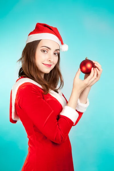 Beautiful woman in new year costume with new year toy — Stock Photo, Image