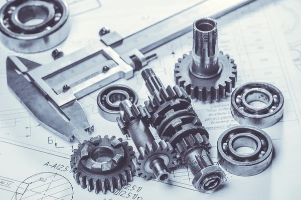 Metal gears on engineering drawings — Stock Photo, Image