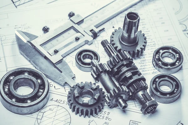 Metal gears on engineering drawings — Stock Photo, Image