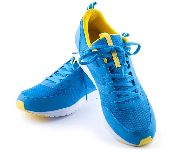 双白色背景上的蓝色运动鞋 — 图库照片