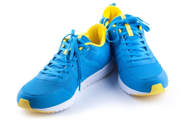 Paire de chaussures de sport bleues sur fond blanc — Photo