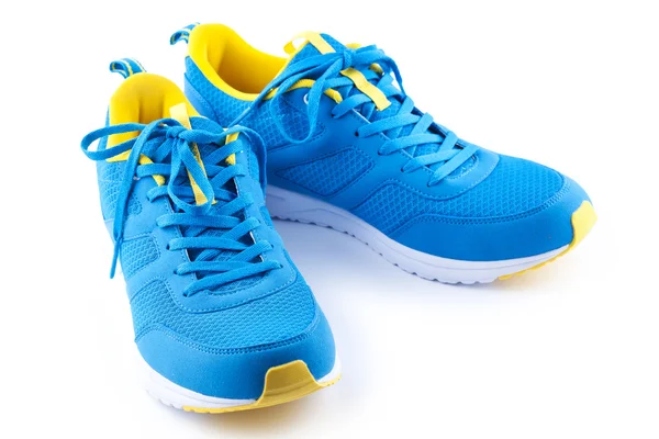 Modré sportovní boty na bílém pozadí — Stock fotografie