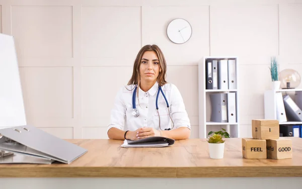 Young female doctor in a white coat — Stock Photo, Image