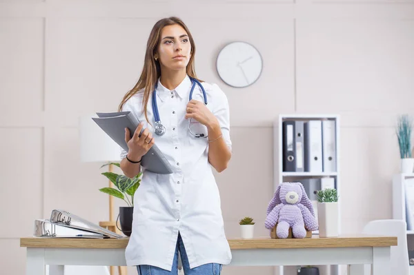 Young female doctor in a white coat — Stock Photo, Image