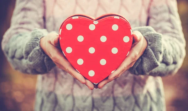 Female Holding heart-shaped box Gift — Stock Photo, Image