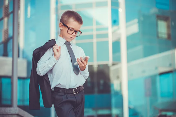 Kid businessman talking on the phone — Stock Photo, Image