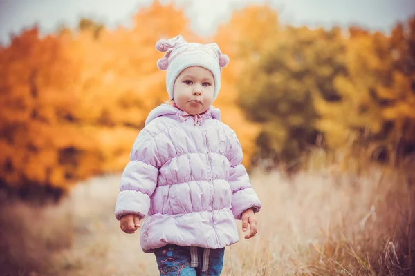 Happy playful baby in the autumn park — Stock Photo, Image