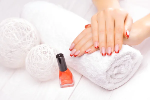 french manicure with red poppy flower