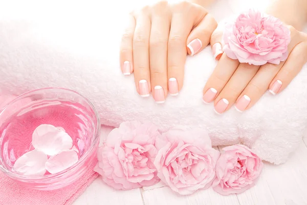 French manicure with rose flowers. spa — Stock Photo, Image