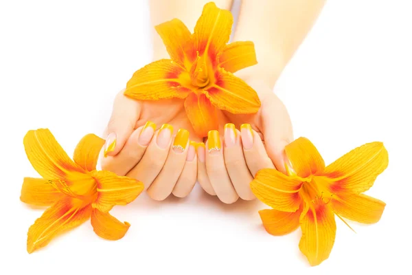 French manicure with orange lily. spa — Stock Photo, Image