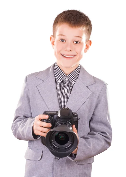 Garoto segurando uma câmera dslr isolado no branco — Fotografia de Stock