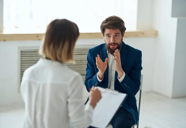 A man at a psychologists appointment, communication, diagnosis of the problem, consultation